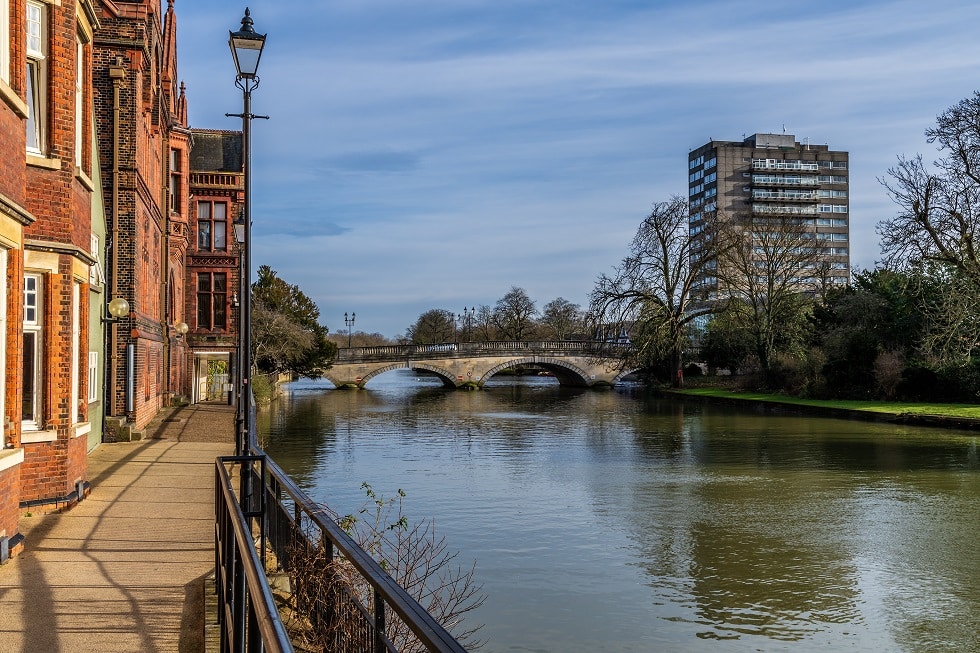 A view down the side of the River Great Ouse in the centre of Bedford, UK on a bright sunny day